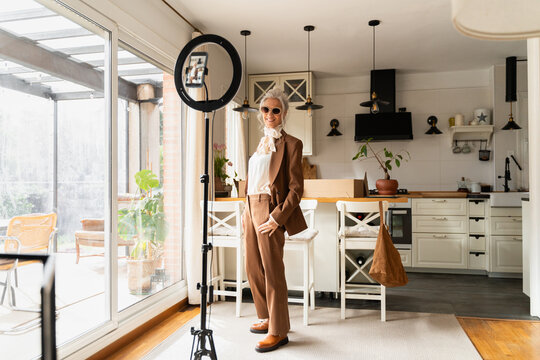 Senior woman full body recording video
