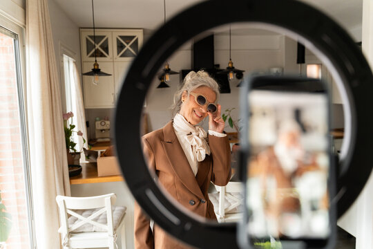 Senior woman posing for product video