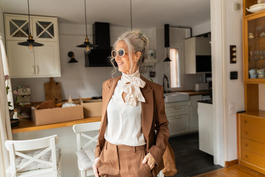 Senior woman wearing sunglasses after purchase
