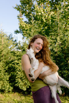 Woman holding goat