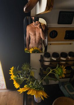 Man Takes Selfie in Tiny Space With Summer Sunflowers