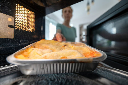 Preparing frozen ready meal lasagna in a microwave