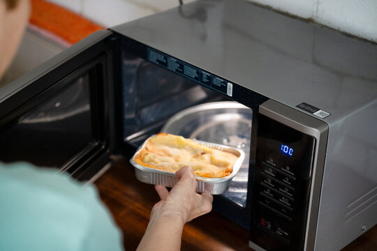 Preparing frozen ready meal lasagna in a microwave