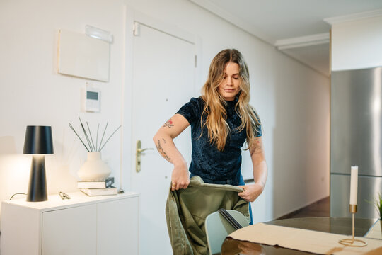 Person arriving home putting away jacket