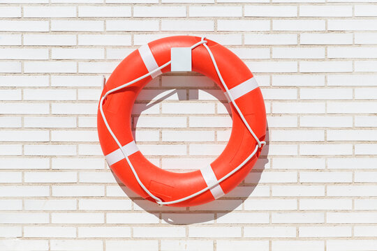 Lifebuoy on a white brick background