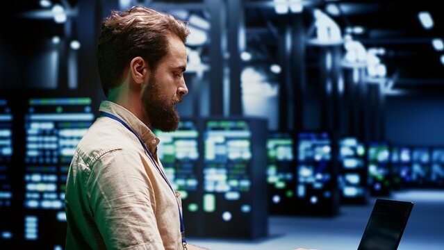 Engineer servicing server clusters with high computing power enabling hyperscale data center to support demanding applications, including artificial intelligence and machine learning workloads