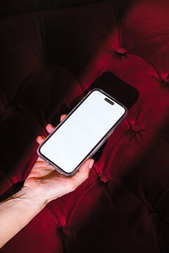 Mock-up phone with empty screen on green velvet background