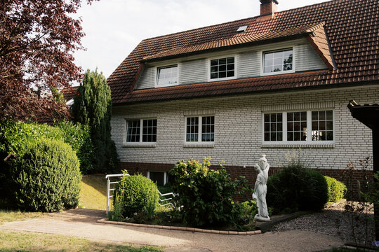 Exterior or White House with red roof in germany
