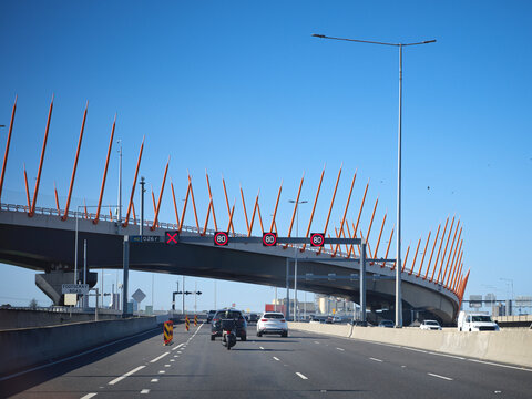 BusyMelbourne Freeway Under a Unique Bridge 
