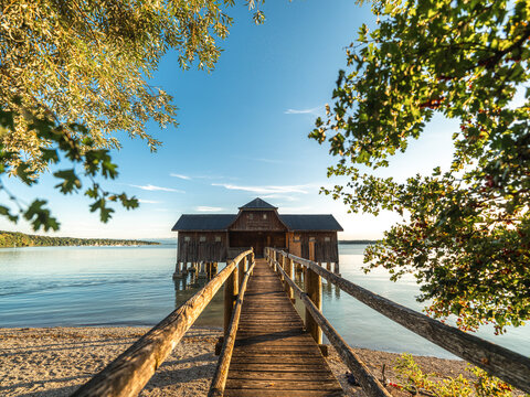 Traditional Alpine Boathouse and Wooden Pier at A Lake