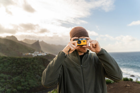 Traveler taking photo on Tenerife coast