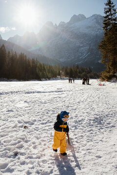 A toddler in the mountains in winter