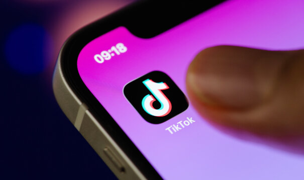 Tik Tok application icon on iPhone 11 pro max screen in hand and have a bokeh for background. Tiktok social media network.April 18, 2026, Bangkok, Thailand