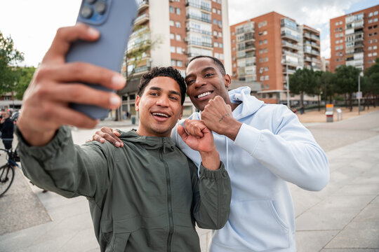 Friends taking selfie outdoors in urban setting