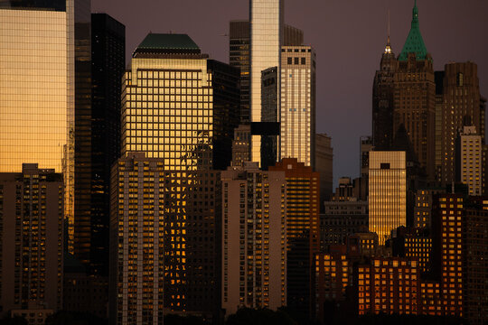 Lower Manhattan Skyscrapers Reflecting Golden Sunset Light
