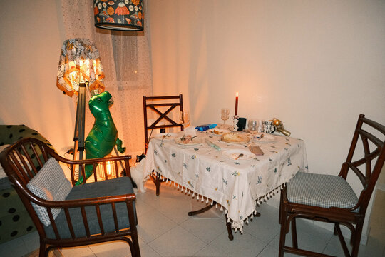 After birthday dinner table in warm evening interior