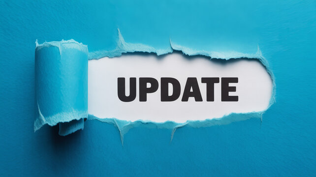 Vibrant blue paper is ripped open to disclose the important word UPDATE on a pristine white background