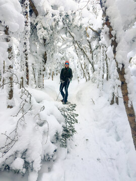 UGC of of young woman n on a winter hike in New Hampshire, USA