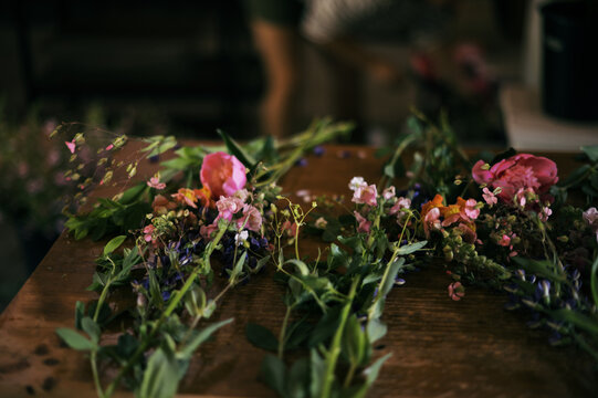 bouquets being assembled on work bench