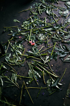 messy floor of cut stems at floral studio
