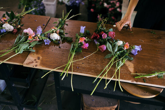 bouquets being assembled on work bench