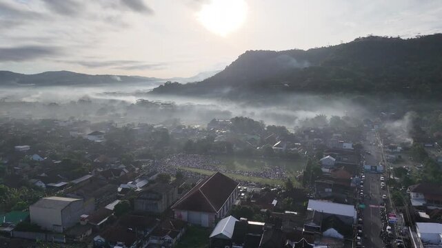 Drone Shot of Islamic Prayer Gathering in Green Field