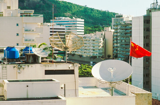 Chinese Flag Over Rooftops