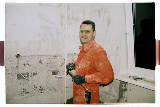 Construction Worker with Hammer During Renovation