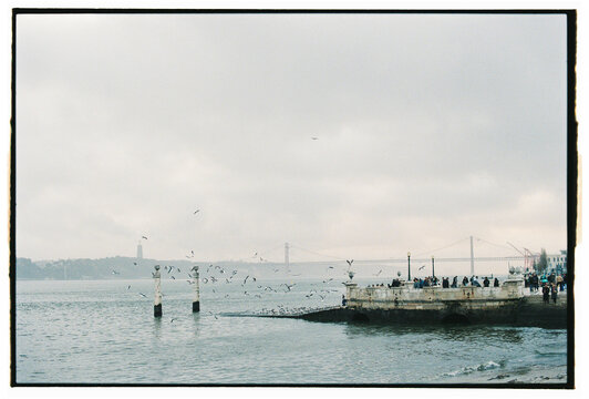 Lisbon riverside with bridge and pier
