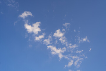 Scattered white clouds in the blue sky at Yunnan Taiyangshan Resort Town © Keyi Zhang