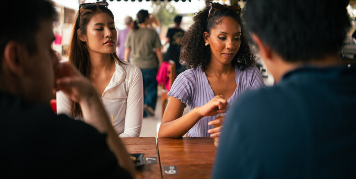 Diverse friends enjoying casual discussion at a lively gathering