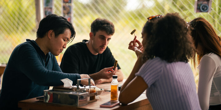 A group of fiends enjoying food and socializing together at lunch