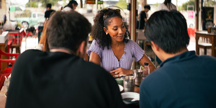 Friends enjoying casual dining and good conversation at a restaurant