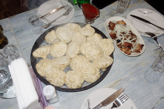 Khinkali in a large dish on the table