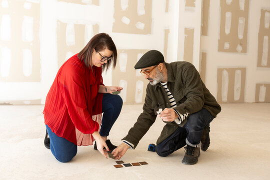 Interior designers team discussing options for space renovation 