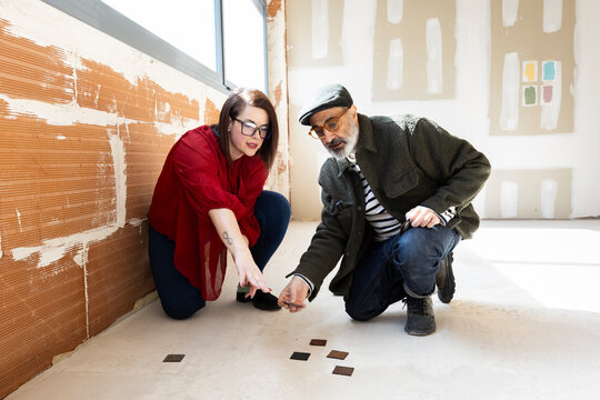 Interior designers team discussing options for space renovation 