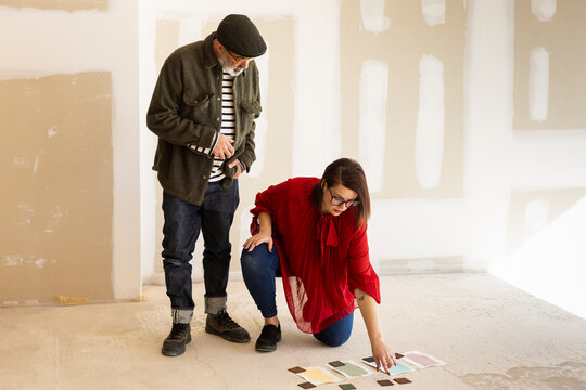 Interior designers team discussing options for space renovation 