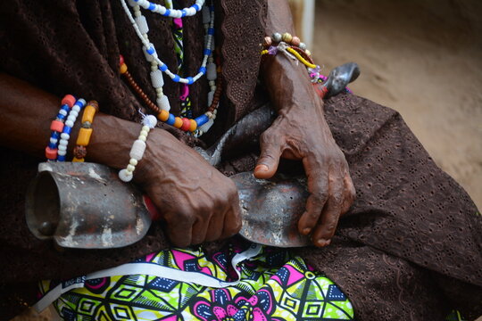 Elderly Woman Holding Traditional Bell  Close up