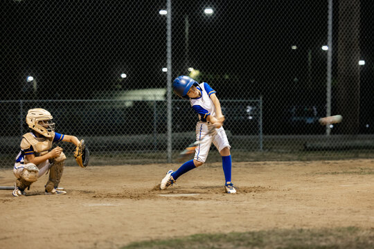 baseball player hits the ball