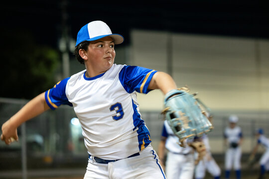 Young baseball pitcher during a ball throw