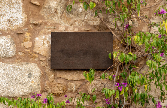 Blank outdoor business wall signage on stone wall 