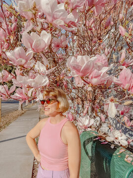 Smiling woman on sidewalk