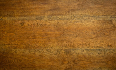 Fototapeta premium Close-up of a rich, polished wooden surface showcasing beautiful grain patterns and textures, ideal for backgrounds and natural elements.