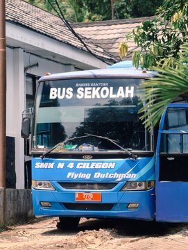 Blue Indonesian School Bus Sekolah SMK N 4 Cilegon Parked at School Building