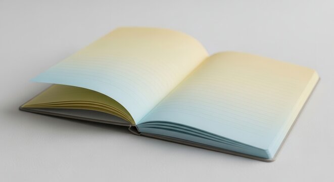 Open notebook with subtly lined gradient pages creating a serene visual for writing and reflection