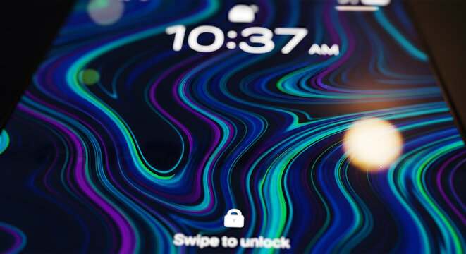 鮮やかな抽象的壁紙が表示されたスマートフォンのロック画面 クローズアップ デジタルライフ