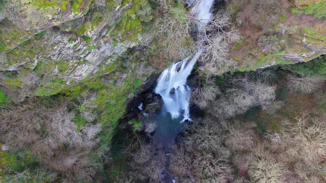 Waterfall Cascading Down On Cliff In O Fito, A Fonsagrada, Spain - Drone Shot