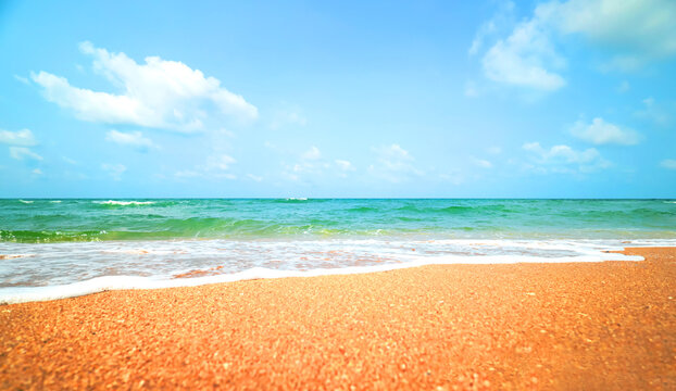 Stunning tropical beach landscape with crystal clear turquoise water and golden sand under a bright blue sky. perfect summer vacation concept serenity, nature's beauty, and a blissful holiday getaway.
