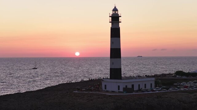 Aerial Panoramic Lighthouse at Sunset with Rocky Coastline, Punta Nati Menorca Mediterranean
