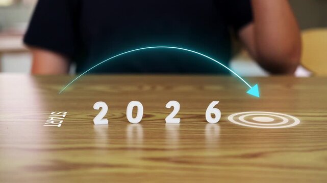 Conceptual business roadmap for 2026 with start point and target goal icon on wooden table for strategy and achievement concept